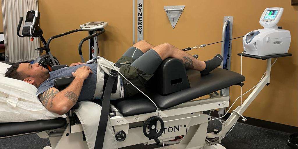 Triton spinal decompression table in use at Cobblestone Spine and Joint Institute Royal Palm Beach FL