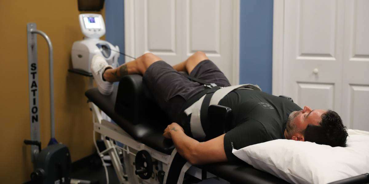 Patient undergoing lumbar spinal decompression therapy at Cobblestone Spine and Joint Institute in Royal Palm Beach FL